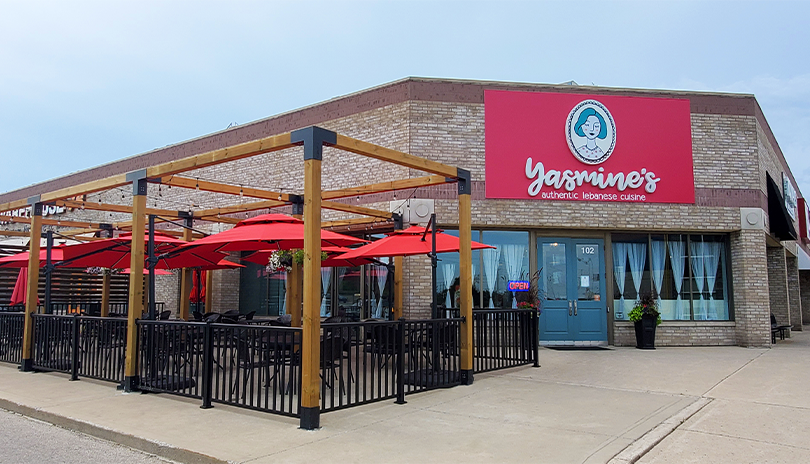 Outdoor patio with string lights and wood beams